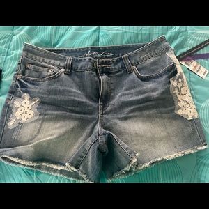 Women’s size 12 brand new with tags INC Jean shorts with lace detail 3 in inseam